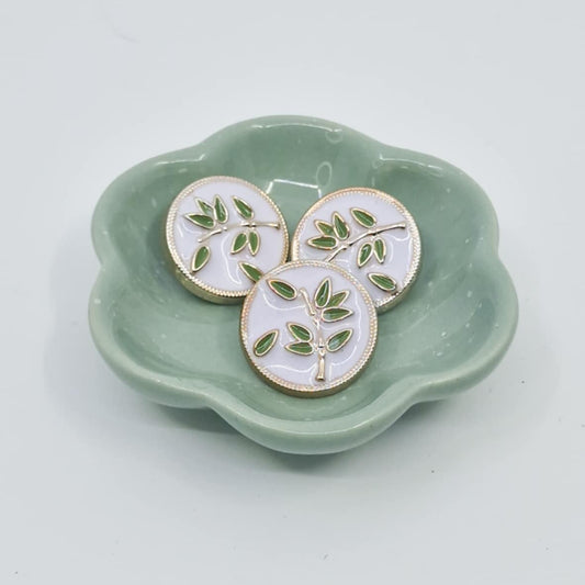 Knapp med laurbærkvist